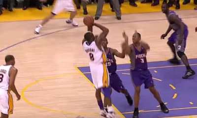 Kobe Bryant (#8) of the Los Angeles Lakers shoots over Raja Bell (#18) and Boris Diaw (#3) for the Game Winner of Game #4 of the NBA Playoffs in 2006 - Screenshot Photo Credit: NBA on ABC