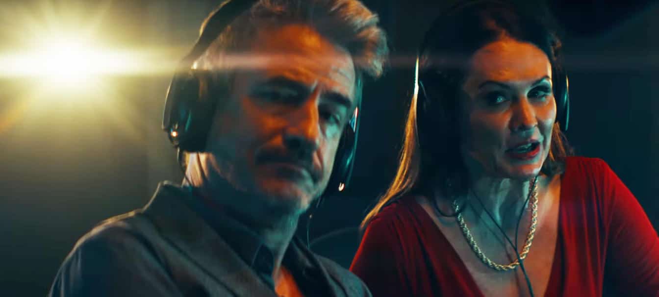 The Purge Season 2 Episode 6 ("Happy Holidays" - Lena Dash more than hints at showing Sydney Rivera The Purge up close and personal next year - From left to right: Bobby Sheridan [Dermot Mulroney] and Lena Dash [Amye Gousset] - Screenshot Photo Credit: USA Network