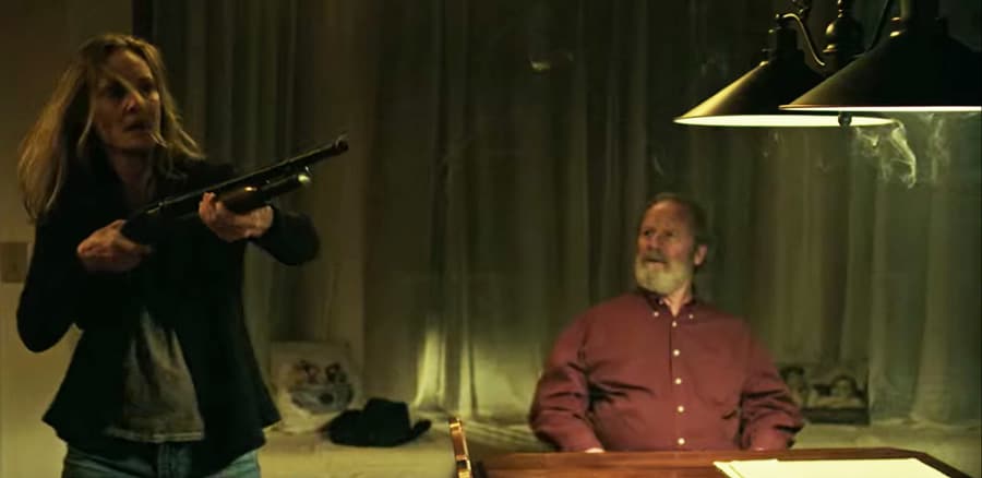 Darlene Snell [Lisa Emery] shoots Dell as Jacob Snell [Peter Mullan] is beside himself - Screenshot Photo via Netflix
