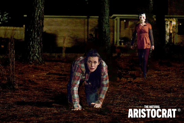 Artwork by Nir Regev / The Natural Aristocrat® based on Photo Still by Universal Studios / Universal Pictures - THE STRANGERS, from left: Liv Tyler as Kristen McKay and Laura Margolis as Pin-Up Girl.