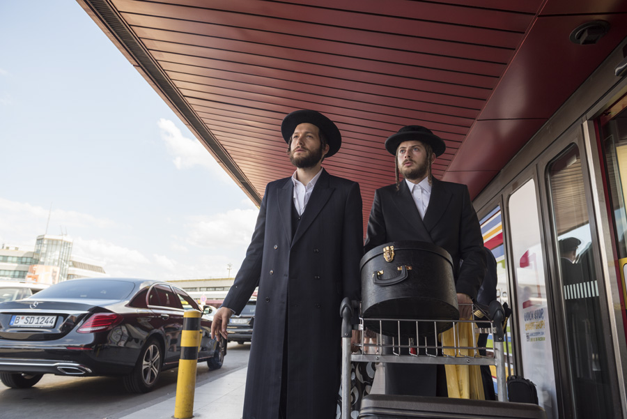 Moishe Lefkovitch [Jeff Wilbusch] and Yanky Shapiro [Amit Rahav] in Unorthodox - Photo Credit: Anika Molnar / Netflix