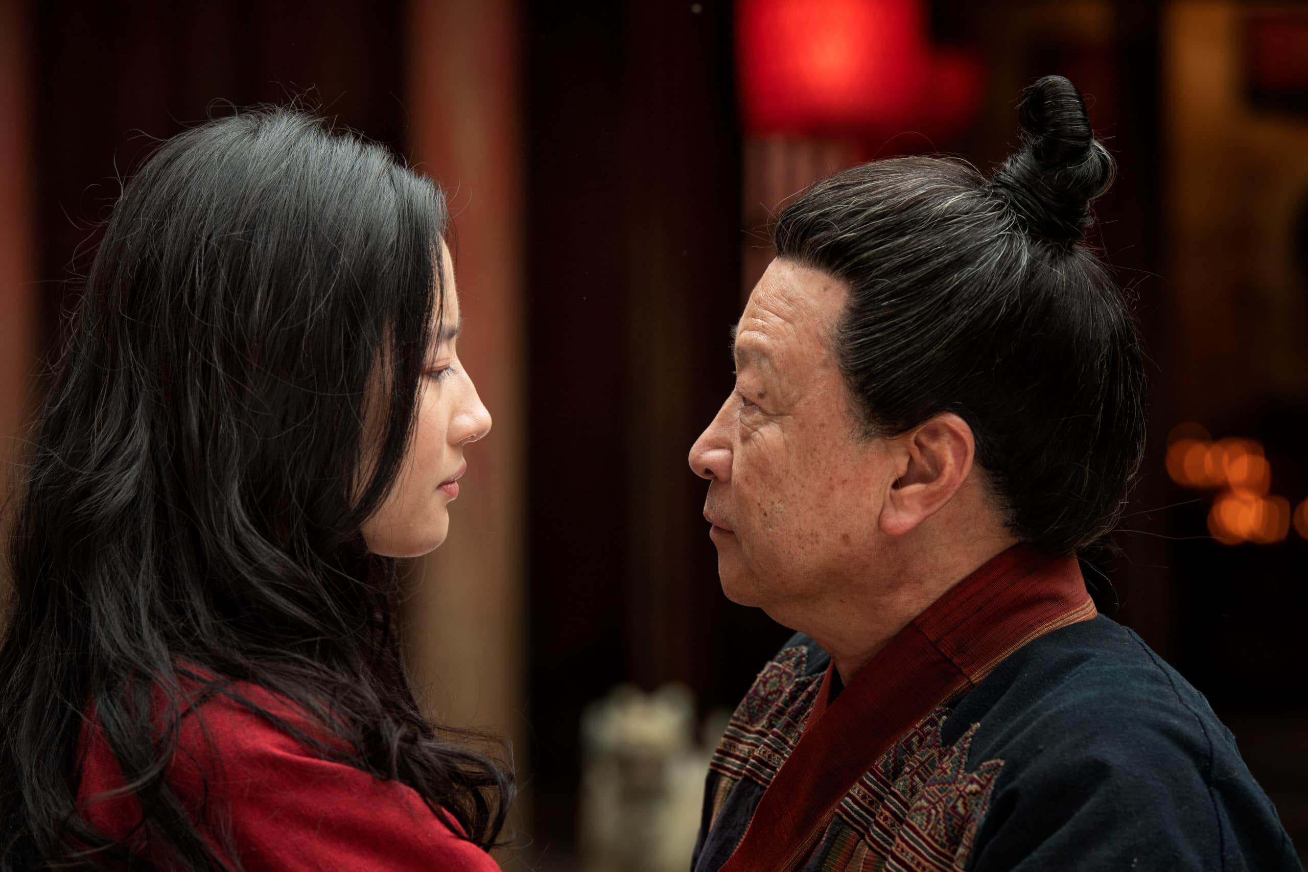Yifei Liu as Mulan and Tzi Ma as Zhou in Disney's MULAN. Photo by Jasin Boland.