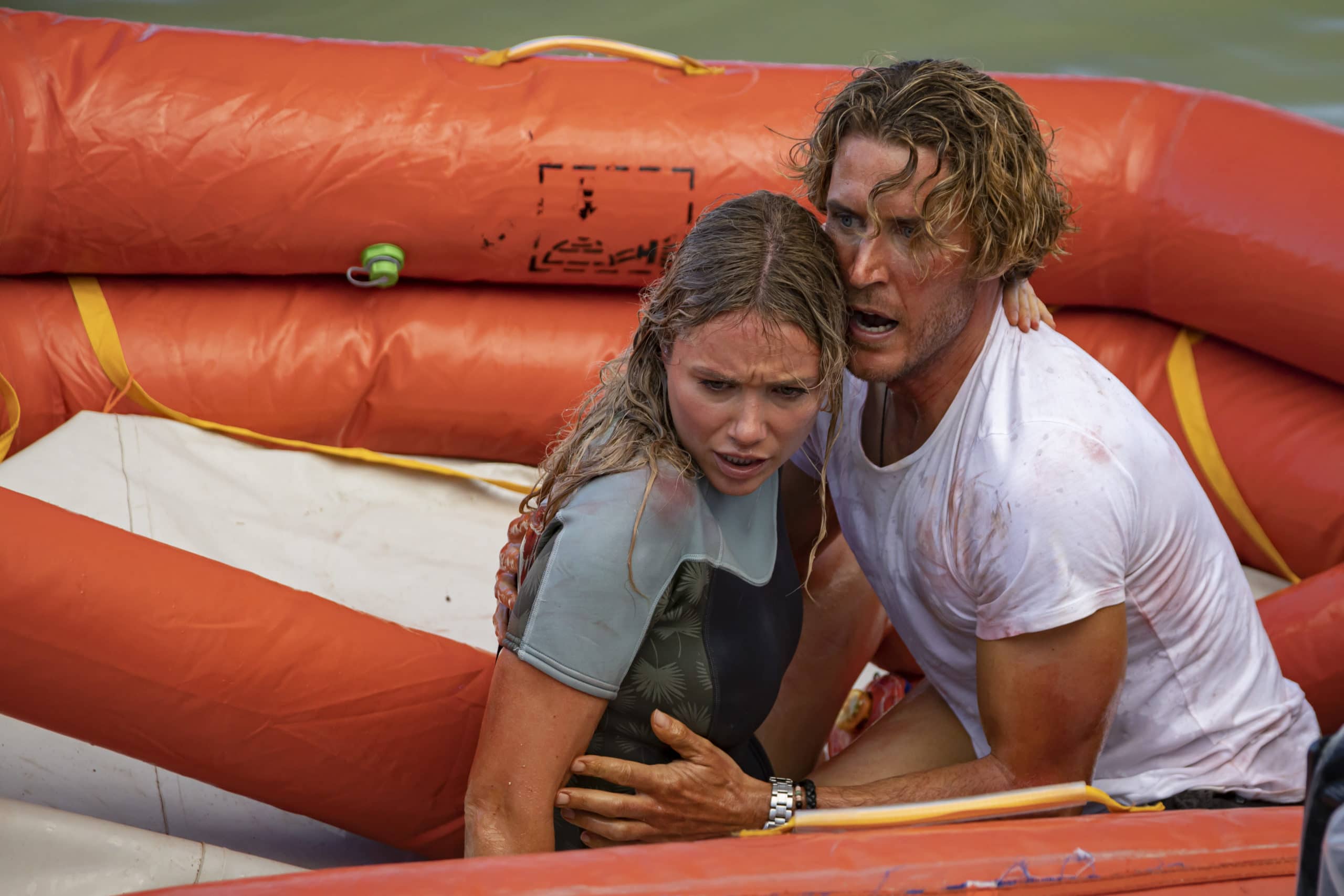 (L-R) Katrina Bowden as Kaz and Aaron Jakubenko as Charlie in the actionadventure/ thriller, GREAT WHITE, an RLJE Films and Shudder release. Photo courtesy of RLJE Films and Shudder.