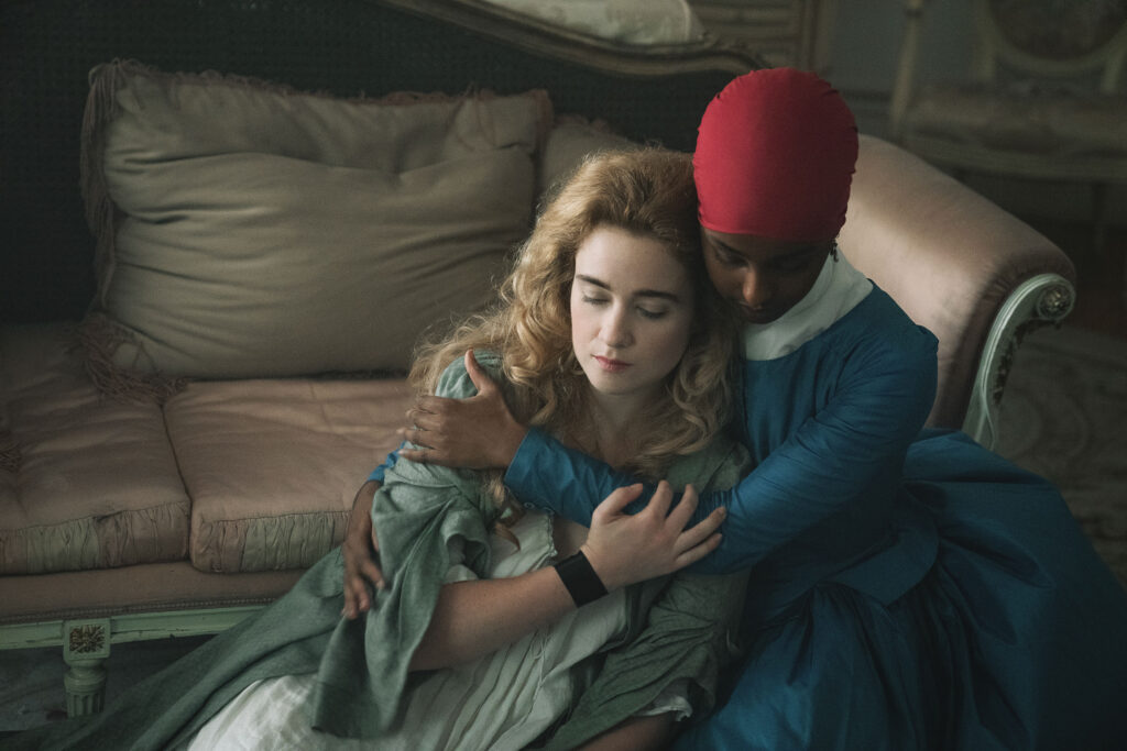 Alice Englert as Camille and Kosar Ali as Victoire in Dangerous Liaisons TV Series Season 1. Photo Credit: STARZ