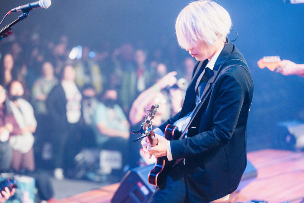 [Alexandros] guitarist Masaki Shirai performs at Anime NYC. Photo Credit: Dower Photography