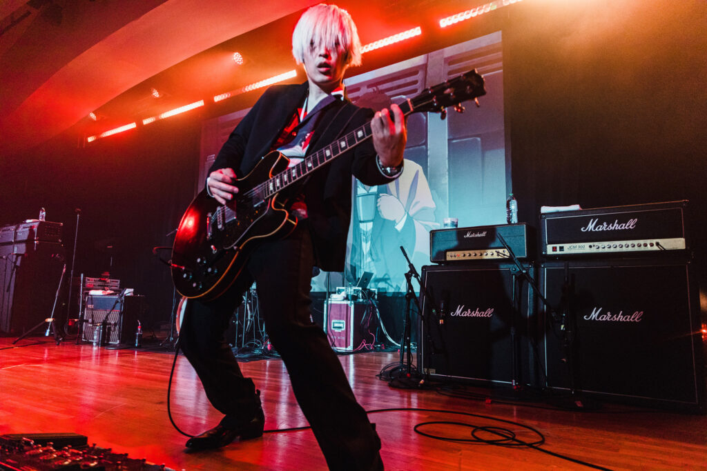 [Alexandros] guitarist Masaki Shirai performs at Anime NYC. Photo Credit: Dower Photography