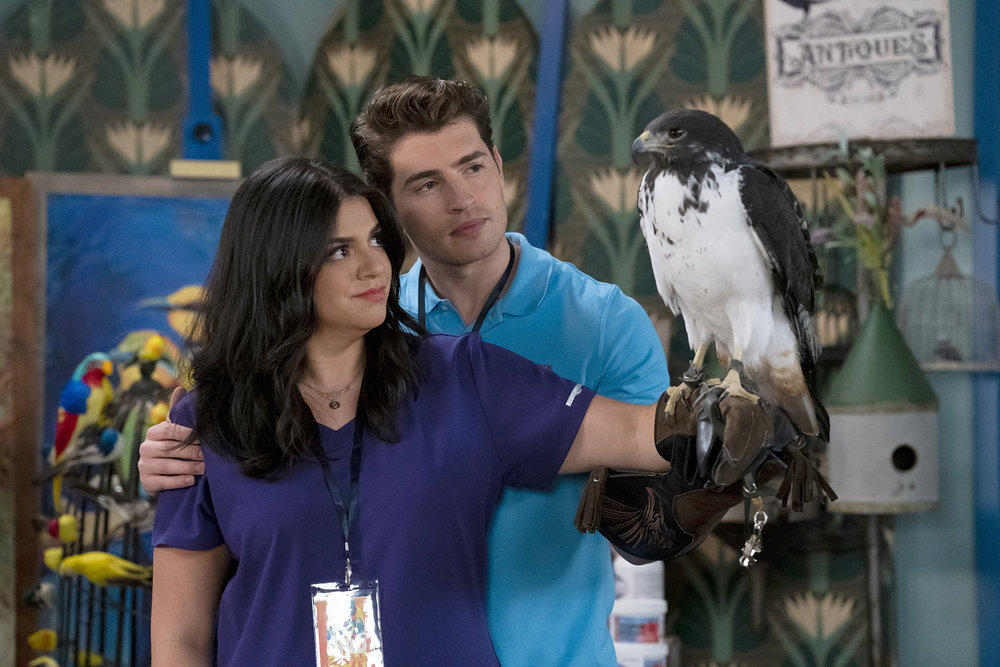 LOPEZ VS LOPEZ -- "Lopez vs Cheating" Episode 116 -- Pictured: (l-r) Mayan Lopez as Mayan, Gregg Sulkin as Dr. Bell -- (Photo by: Nicole Weingart/NBC)