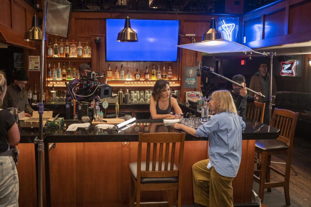 Sara Amini behind the scenes in Lucky Hank (Season 1, Episode 3). Photo Credit: Sergei Bachlakov/AMC