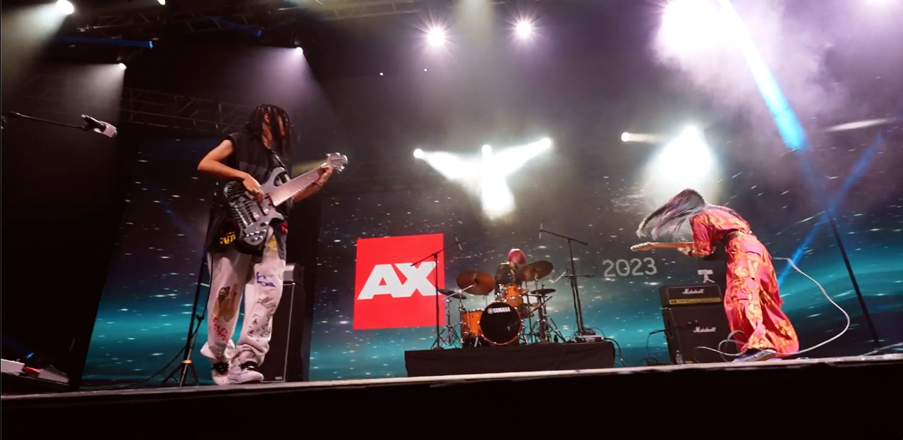 ASTERISM Band. From left to right: MIYU, MIO, and HAL-CA). Photo captured from live footage provided by Sony Music Entertainment Japan (SMEJ)