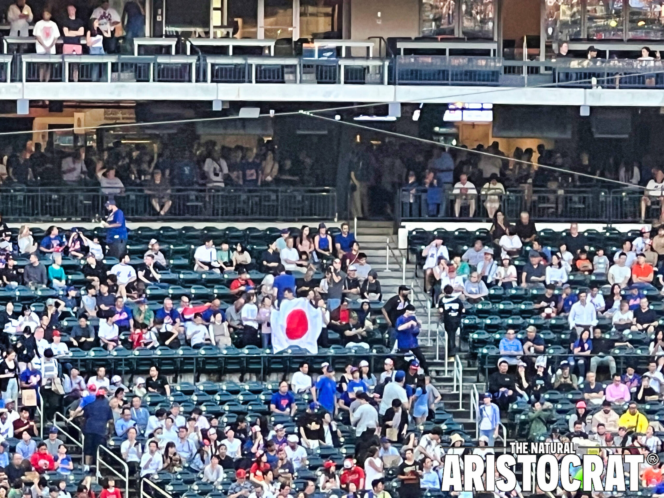 New York Mets fans hold up Japan flag during Citi Field's Japanese Heritage Night. Photo Credit: The Natural Aristocrat® - Nir Regev