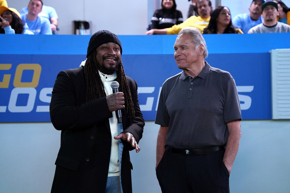 LOPEZ VS LOPEZ -- "Lopez vs Raider Nation" Episode 205 -- Pictured: (l-r) Marshawn Lynch as Himself, Jim Plunkett as Himself -- (Photo by: Nicole Weingart/NBC)