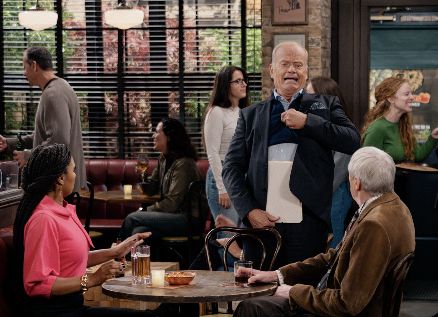 L-R: Toks Olagundoye as Olivia, Kelsey Grammer as Frasier and  Nicholas Lyndhurst as Alan in Frasier, episode 4, season 2 streaming on Paramount+, 2024.  Photo credit: Chris Haston/Paramount+