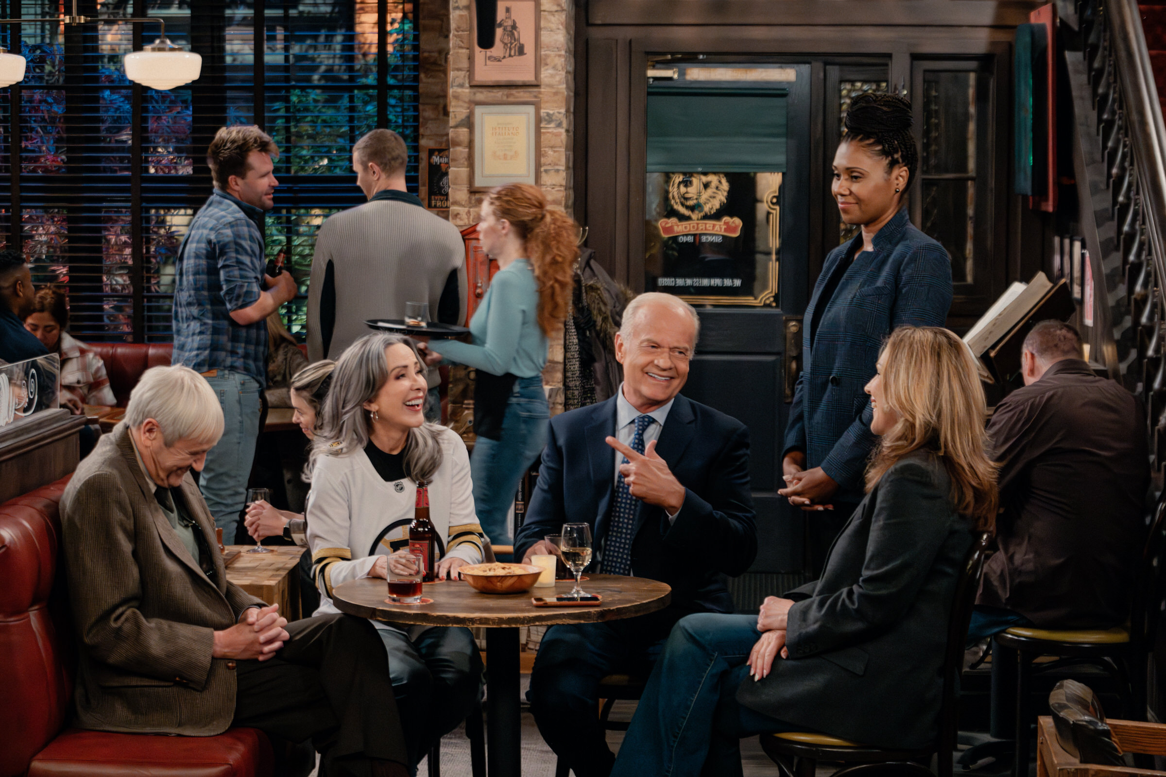 L-R: Nicholas Lyndhurst as Alan, Patricia Heaton as Holly, Kelsey Grammer as Frasier, Toks Olagundoye as Olivia and Peri Gilpin as Roz in Frasier, episode 9, season 2 streaming on Paramount+, 2024. Photo credit: Chris Haston/Paramount+