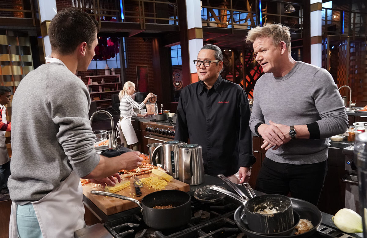 MASTERCHEF: L-R: Contestant Nick with special guest chef Masaharu Morimoto and host/chef Gordon Ramsay in the “King of the Crabs” episode of MASTERCHEF airing Wednesday, July 24 (8:00-9:00 PM ET/PT) on FOX. © FOX MEDIA LLC. CR: Greg Gayne/ FOX.