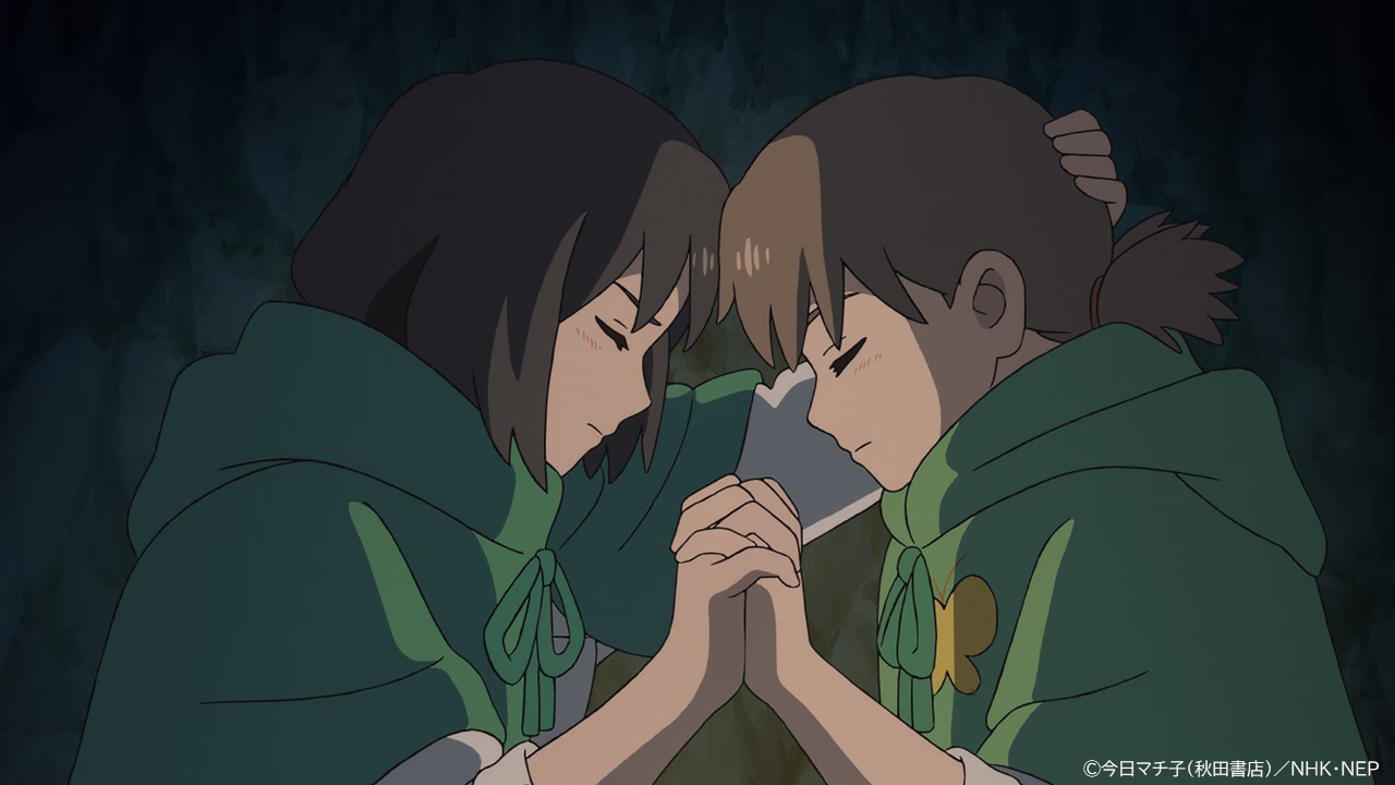 San and Mayu, eyes closed, foreheads together with hands clasped in a dark cave.